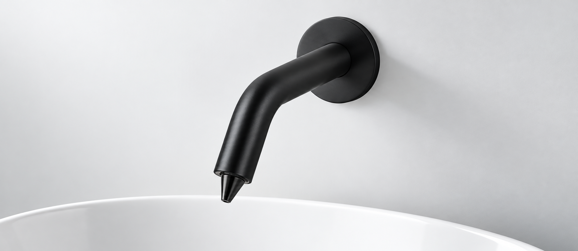 Modern commercial restroom using automatic soap dispensers as part of a coordinated touchless fixture system