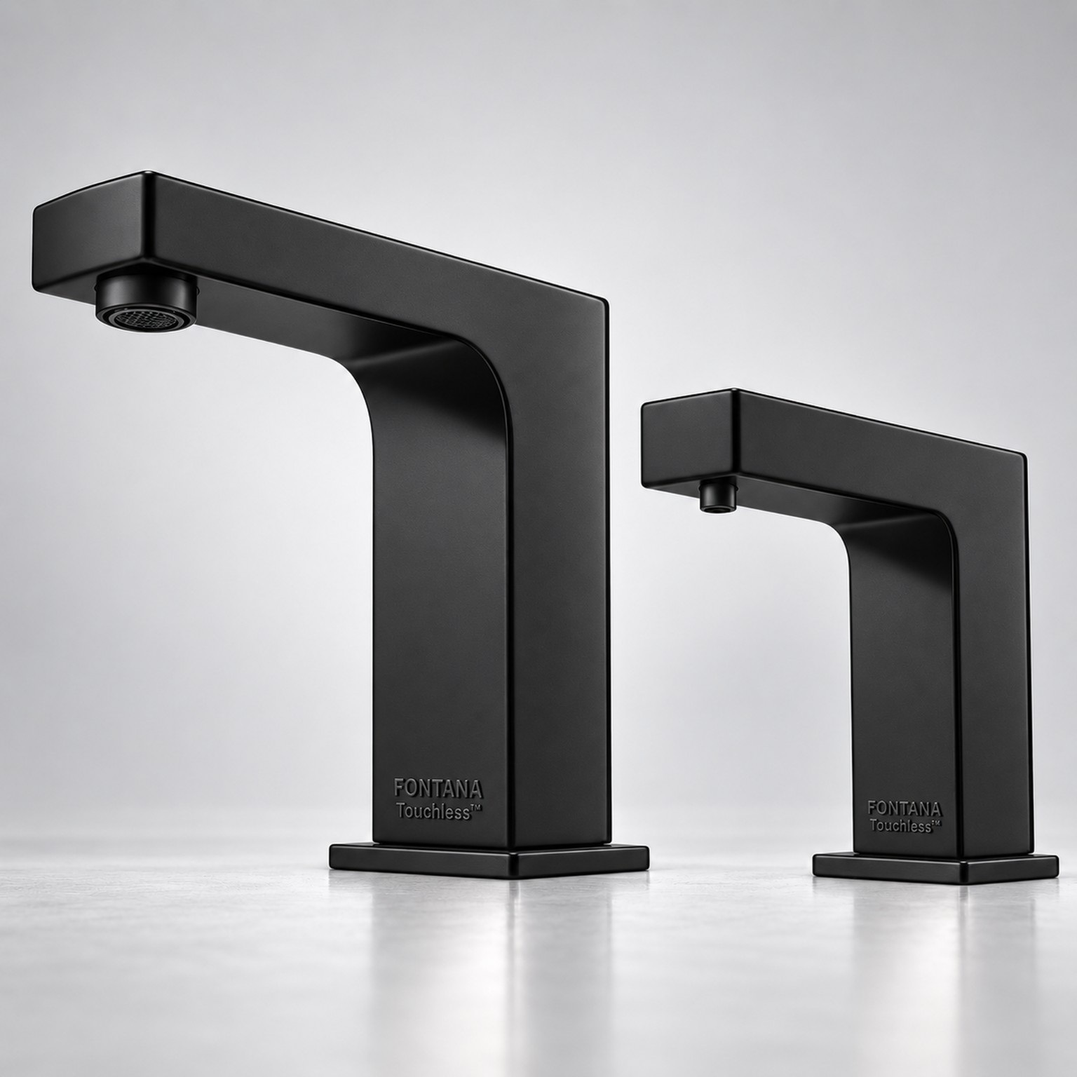 Matte black angular faucet and matching soap dispenser pair.
